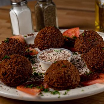 Lava Lounge - a plate of fried meatballs and tomatoes - Hookah Bars Near Me - Kenner, Louisiana Lava Lounge - a plate of fried meatballs and tomatoes - Hookah Bars Near Me - Kenner, Louisiana