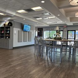 The Table - Main space when you walk in. Featuring one of the many screens and ads I mentioned in my review.