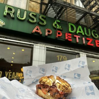 Russ & Daughters - The Classic: ET bagel, salmon, cream cheese, tomatoes, red onions and capers. You can choose from between 8 different types of lox. - Bagels Near Me - New York, New York Russ & Daughters - The Classic: ET bagel, salmon, cream cheese, tomatoes, red onions and capers. You can choose from between 8 different types of lox. - Bagels Near Me - New York, New York