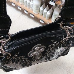 Tandy Leather - Carry purse. Got a department for my pistol.