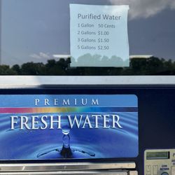 Purified Water To Go - Filling water bottles for Barefoot and Free Yoga Festival, at Proud Lake Recreation Park.