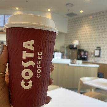 Costa Coffee - a hand holding a cup of coffee - Coffee & Tea Near Me - Atlanta, Georgia Costa Coffee - a hand holding a cup of coffee - Coffee & Tea Near Me - Atlanta, Georgia