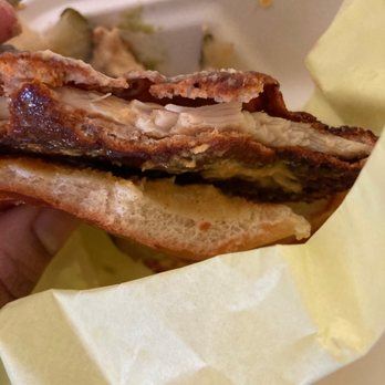 Mother Clucker - a person holding a sandwich in a styrofoam container - Food Delivery Services Near Me - Rancho Cucamonga, California Mother Clucker - a person holding a sandwich in a styrofoam container - Food Delivery Services Near Me - Rancho Cucamonga, California