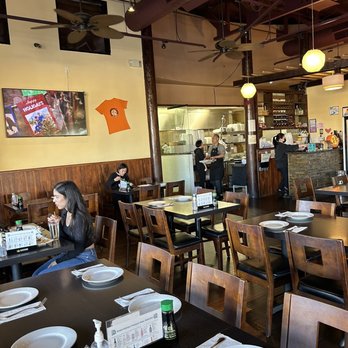 Enishi Kitchen - a woman sitting at a table - Sushi Bars Near Me - Brentwood, California Enishi Kitchen - a woman sitting at a table - Sushi Bars Near Me - Brentwood, California