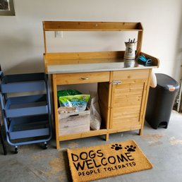 Gardening workbench with storage plus small rolling cart with three shelves for added storage and easy transport of large or heavy items. Gardening workbench with storage plus small rolling cart with three shelves for added storage and easy transport of large or heavy items.