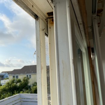 Resort Realty - Check out the huge spiders in the screen to walk out to the balcony - Property Management Near Me - Nags Head, North Carolina