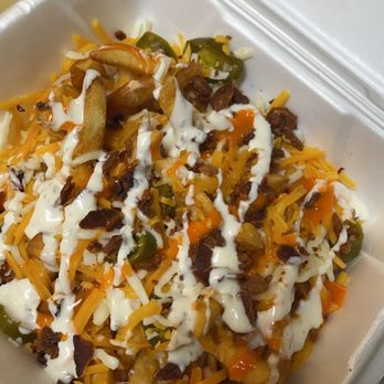 Dreamers Restaurant - Fries loaded with shredded cheese, bacon, jalapeños, ranch and hot sauce. Available upon request. - Burgers Near Me - Moncks Corner, South Carolina Dreamers Restaurant - Fries loaded with shredded cheese, bacon, jalapeños, ranch and hot sauce. Available upon request. - Burgers Near Me - Moncks Corner, South Carolina