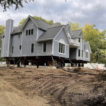 Grondin Builders - a house being lifted by a truck - General Contractors Near Me - Tolland, Connecticut Grondin Builders - a house being lifted by a truck - General Contractors Near Me - Tolland, Connecticut