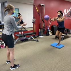 Atala Physical Therapy - Julie, our exercise specialist, focuses on balance with a patient as they go over at home exercises.