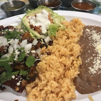 Sunshine Mexican Cafe - Cheese enchiladas with guajillo sauce topped with chorizo and potatoes and just a few of the fantastic salsas. - Mexican Near Me - Joliet, Illinois