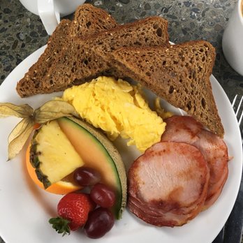 The Village - a plate of breakfast food and a cup of coffee - Breakfast & Brunch Near Me - Victoria, British Columbia The Village - a plate of breakfast food and a cup of coffee - Breakfast & Brunch Near Me - Victoria, British Columbia