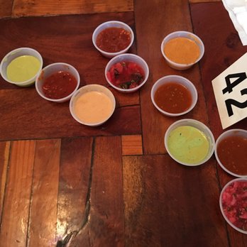 La Santisima - Salsas galore! Best were the Pecan (Center pale orange), Strawberry (Center Red/Green), and the Chipotle (Left)between green & orange) - Mexican Near Me - Phoenix, Arizona La Santisima - Salsas galore! Best were the Pecan (Center pale orange), Strawberry (Center Red/Green), and the Chipotle (Left)between green & orange) - Mexican Near Me - Phoenix, Arizona