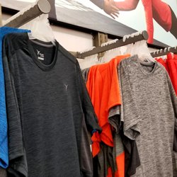 Old Navy - You could buy a dri-fit Under Armour tee for $40+ or you could come to Old Navy and buy them for $12.