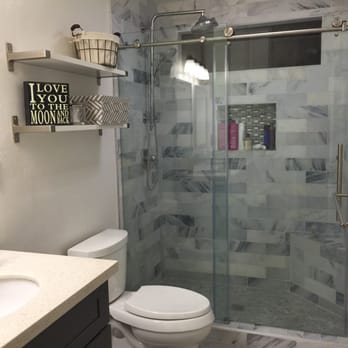 Modern Concepts Contracting - New marble shower with beautiful glass doors - General Contractors Near Me