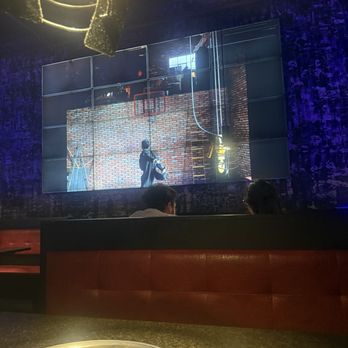 Iron Age Korean Steak House - Screen on wall playing music videos - Korean Near Me - Duluth, Georgia Iron Age Korean Steak House - Screen on wall playing music videos - Korean Near Me - Duluth, Georgia