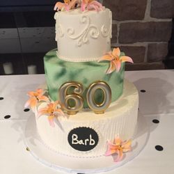 Designed Elegance Pastry Shoppe - This stacked birthday cake serves about 70 people