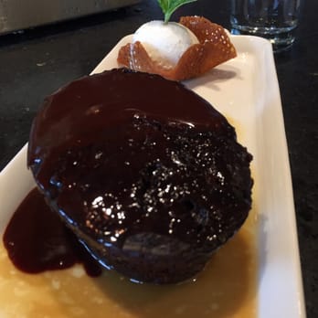 Earls Kitchen + Bar - Toffee pudding with vanilla ice cream in a toffee shell - New American Near Me - Somerville, Massachusetts