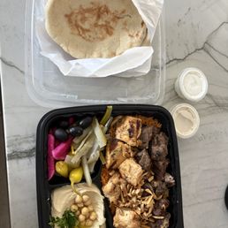 mixed plate that was supposed to come with Kefta, chicken, and steak. They were out of kefta. rice, hummus, pita, pickles