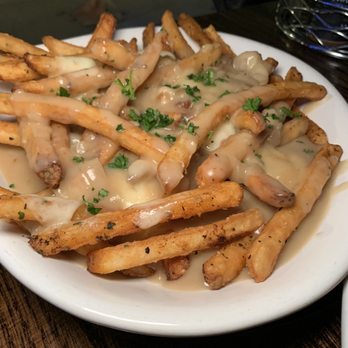 The Evergreen - Poutine- Fries, NYS cheese curds, vegetarian brown gravy - American Near Me - Syracuse, New York The Evergreen - Poutine- Fries, NYS cheese curds, vegetarian brown gravy - American Near Me - Syracuse, New York