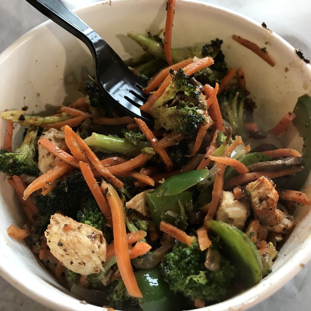 a bowl of broccoli and carrots a bowl of broccoli and carrots