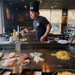 Hibachi chef wielding his craft Hibachi chef wielding his craft