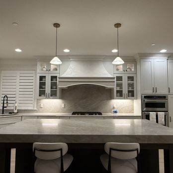 Gencon - Plaster range hood vent to bring in light warmth and contrast to the ever so white kitchen. - General Contractors Near Me Gencon - Plaster range hood vent to bring in light warmth and contrast to the ever so white kitchen. - General Contractors Near Me