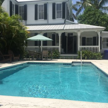 The Conch House Heritage Inn - Sitting + enjoying the shade + water after walking @ Duval St. - Hotels Near Me - Key West, Florida The Conch House Heritage Inn - Sitting + enjoying the shade + water after walking @ Duval St. - Hotels Near Me - Key West, Florida