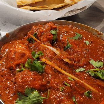 Spice Garden Indian Cuisine - Chicken Vindaloo. Spice level 8. Nice heat, not too hot. Rich with spice & quality protein. Yummm. Roti bread was fresh & buttery. - Indian Near Me - Tucson, Arizona Spice Garden Indian Cuisine - Chicken Vindaloo. Spice level 8. Nice heat, not too hot. Rich with spice & quality protein. Yummm. Roti bread was fresh & buttery. - Indian Near Me - Tucson, Arizona