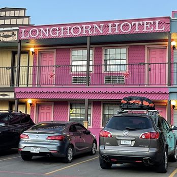 Big Texan Motel - Outside view of our room, made to look like storefronts and each being unique. Great close parking. - Hotels Near Me - Amarillo, Texas