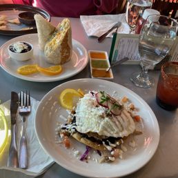 Breakfast tostada with carnitas, breakfast burrito, Bloody Maria, chips and salsa. Breakfast tostada with carnitas, breakfast burrito, Bloody Maria, chips and salsa.