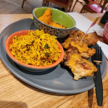 Nando's Peri-Peri - Chicken thigh with mango lime sauce... Portuguese Rice and Sweat Potatoes... perfect portion - Chicken Shop Near Me - Chicago, Illinois Nando's Peri-Peri - Chicken thigh with mango lime sauce... Portuguese Rice and Sweat Potatoes... perfect portion - Chicken Shop Near Me - Chicago, Illinois