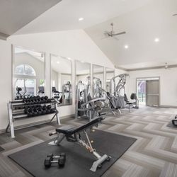 Camden Buckingham Apartments - 24-hour fitness center with strength equipment at Camden Buckingham apartments in Richardson, TX