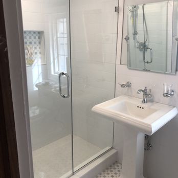 OM Construction Contractors - a bathroom with a sink and shower - General Contractors Near Me - Passaic, New Jersey