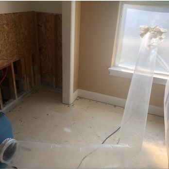 Rush Relief Restoration Services - Adjacent closet and room. Note protective plastic room barrier. - Damage Restoration Near Me - Redding, California