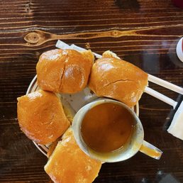 Slider rolls toasted and their signature bbq sauce Slider rolls toasted and their signature bbq sauce