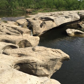 McKinney Falls State Park - The lower falls, currently a bridge over calm waters, but watch out when it rains. - Parks Near Me - Austin, Texas McKinney Falls State Park - The lower falls, currently a bridge over calm waters, but watch out when it rains. - Parks Near Me - Austin, Texas
