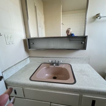 Friendly Remodeling - Full picture of 1960 circa vanity prior to Friendly Remodeling. - General Contractors Near Me