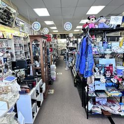 Save A Life Thrift Stores - Right side: Disney collectibles, electronics  Left side  back wall : CD's , DVD's, Books