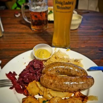 Edelweiss Biergarten - Classic German sausage selection, comes with Sauerkraut, red cabbage & potatoes wedges. Flushed down with ice cold Koenig Ludwig Weissbier. - German Near Me - Phoenix, Arizona Edelweiss Biergarten - Classic German sausage selection, comes with Sauerkraut, red cabbage & potatoes wedges. Flushed down with ice cold Koenig Ludwig Weissbier. - German Near Me - Phoenix, Arizona