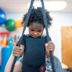 Vision Forward Association - A visually impaired little girl is receiving physical therapy