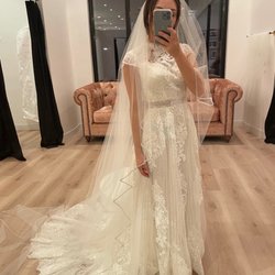 J Golden Needle Alterations & Tailoring - Dress after alterations, at the bridal shop trying on veils