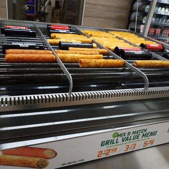 7-Eleven - a display of hot dogs on a conveyor belt - Gas Stations Near Me - Virginia Beach, Virginia