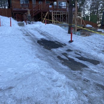 Big Bear Cool Cabins - Impossible to walk up to the house without slipping on all the ice. Classy yellow tape too. - Property Management Near Me - Big Bear Lake, California