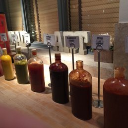 Photo of Capitalist Pig - Saint Louis, MO, United States. The sauce selection.  That jalapeno one scares me!