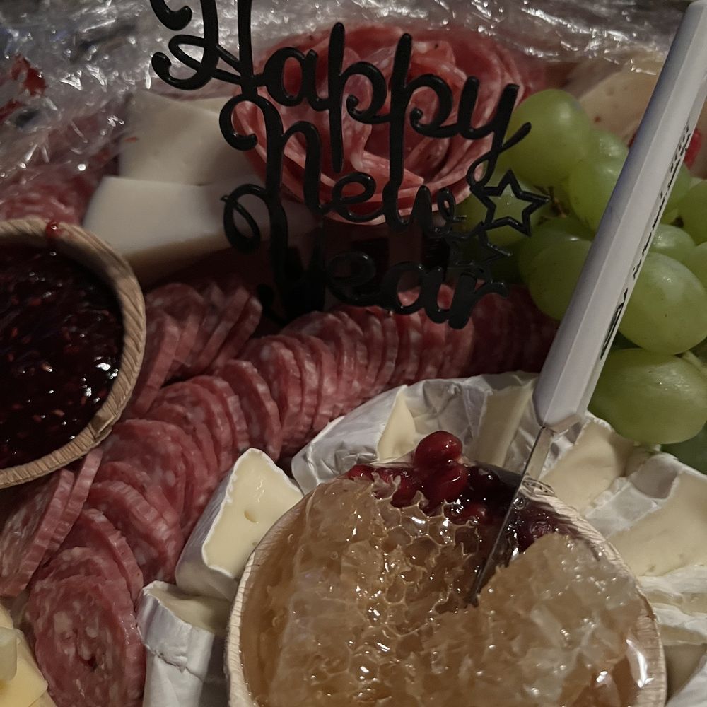 Boards and More Charcuterie - Beautiful honeycomb in amongst the meats and cheeses. An entire tray of a variety of crackers was also provided.. - Caterers Near Me