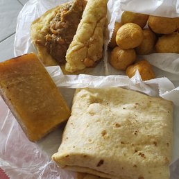 Clockwise from top left: channa double, pholourie, roti, cassava pone! Clockwise from top left: channa double, pholourie, roti, cassava pone!