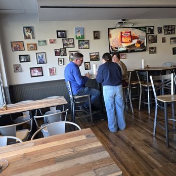 Top Dawgs Pub & Deli - A server taking an order from some customers. - Pubs Near Me - Roanoke, Virginia Top Dawgs Pub & Deli - A server taking an order from some customers. - Pubs Near Me - Roanoke, Virginia