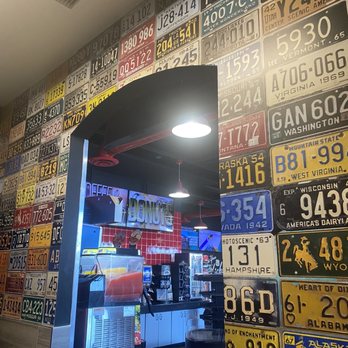 Chevron - a display of license plates on a wall - Gas Stations Near Me - Barstow, California Chevron - a display of license plates on a wall - Gas Stations Near Me - Barstow, California