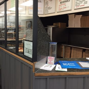 Vincenzo's Pizzeria - The window next to the cashier's station reminds me of a dirty, retired post office kiosk. - Pizza Near Me - Elmira, New York Vincenzo's Pizzeria - The window next to the cashier's station reminds me of a dirty, retired post office kiosk. - Pizza Near Me - Elmira, New York
