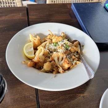 Demetris Woodstone Taverna - Roasted Cauliflower- a simple yet tasty dish especially after squeezing the lemon on top - Mediterranean Near Me - Edmonds, Washington